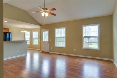 A view of the open floor plan from the living room to the dining area