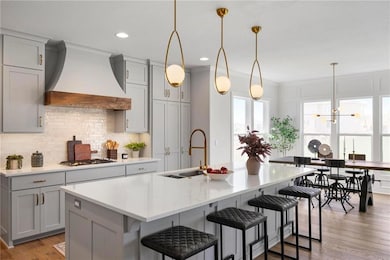 Kitchen with island *PHOTO IS PREVIOUS FINIHSED MODEL