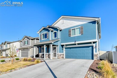 Craftsman-style house featuring driveway, stone si