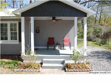 Relax on your front porch overlooking the quiet st