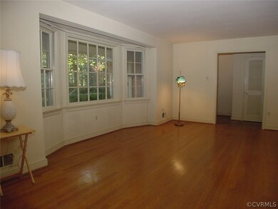 Living room has wide opening to the foyer