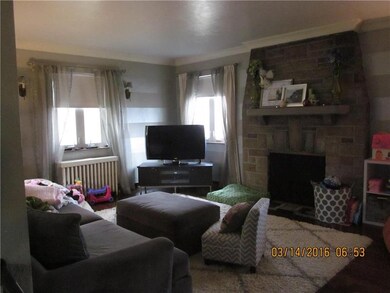 Large livingroom with ample windows and exposed ha