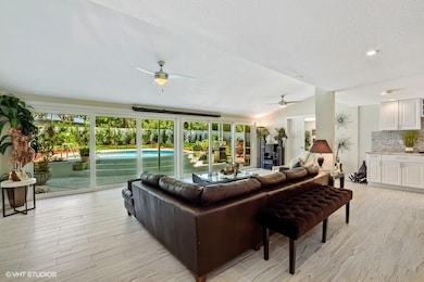 living room overlooking pool and the backyard