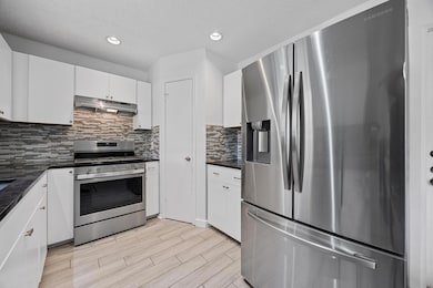 Kitchen with stainless steel appliances, under ca