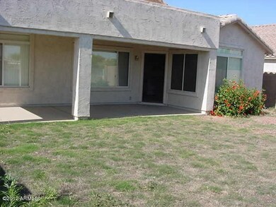 LARGE COVERED PATIO AND GRASS