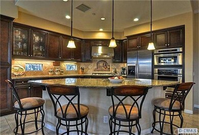 Cooks enjoy a gourmet kitchen with large center is