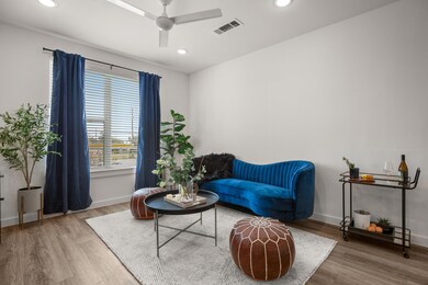 Sitting room featuring wood finished floors, ceil