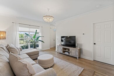 The great room has new blonde hardwood floors