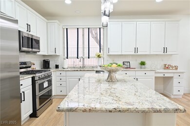 Kitchen with tasteful backsplash, light wood-type