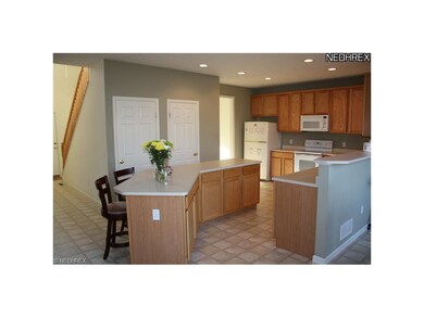Large work island in Kitchen with seating for two.