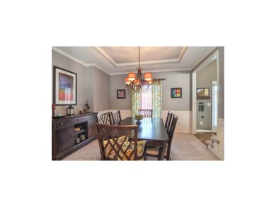 Nice size dining room with neutral wall color and 
