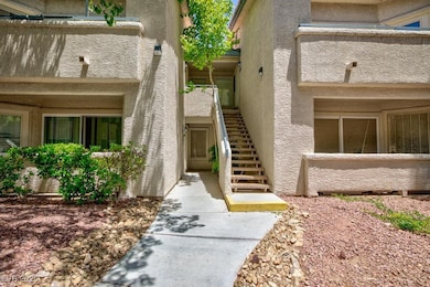 View of exterior entry with stucco siding