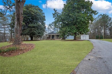 View of front of property featuring a garage, apha
