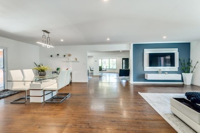 Dining space with dark wood-type flooring