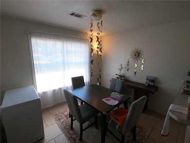 Dining room with light tile patterned flooring and