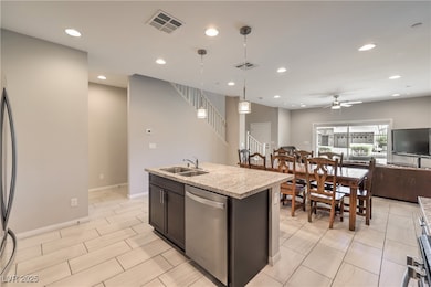 Kitchen with open floor plan, visible vents, dishw