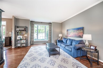 Formal living room with large window that allows a
