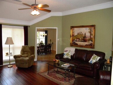 Family Room features hand scrapped hardwood floors