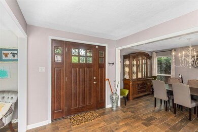 Front entry opens to living room and formal dining