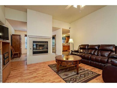 Living Room. Gorgeous wood floors and a free standing fireplace adds elegance to the Living Room.