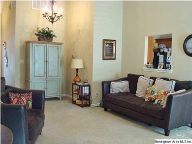 Great Room has Dining area with chandelier or can 