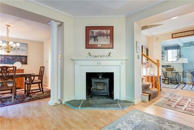 Wood stove in fireplace.