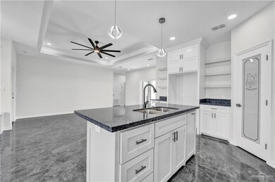 Kitchen featuring open shelves, white cabinetry, a ceiling fan, decorative light fixtures, and recessed lighting