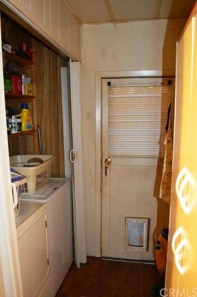 Built-in laundry area and door to the carport area
