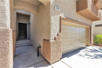 Property entrance featuring stucco siding