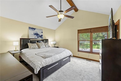 Bedroom with beam ceiling, light colored carpet, high vaulted ceiling, and a ceiling fan