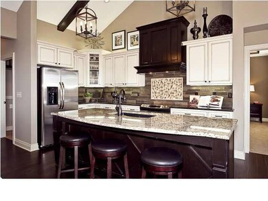 Unique kitchen design features painted cabinetry a