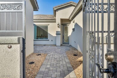 Doorway to property with a tiled roof and stucco s