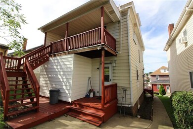 Dual decks on the rear of the property offer secon