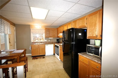 Kitchen with eating area opens out to deck.