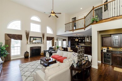 Two Story Great Room with Wood Floors and Dynamic Window Wall