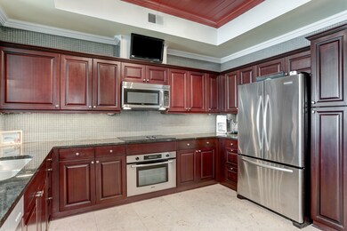 The Kitchen features sleek stainless steel applian