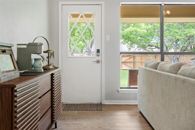 Entryway with hardwood / wood-style floors