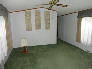 The living room from the kitchen doorway, and to t