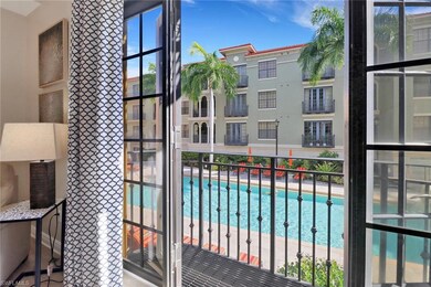 Balcony featuring a community pool