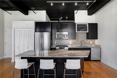 Straight view of kitchen, island, and KitchenAid a