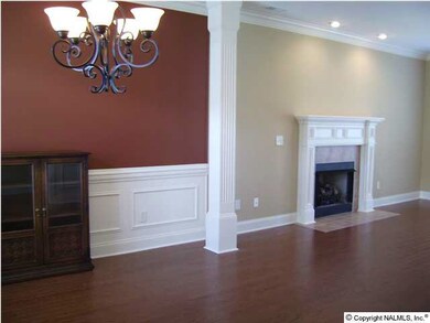 Open floor plan features dining room that flows right into the family room with cozy gas firepalce.
