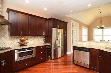 Kitchen features stainless appliances, ceramic til