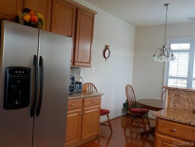 Kitchen with hardwood floor and stainless steel ap