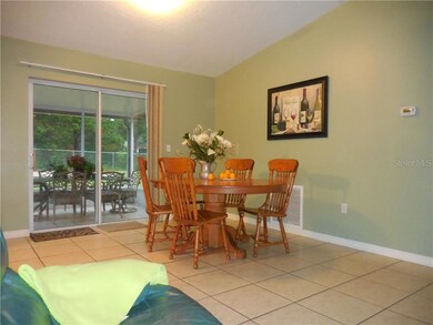 dining area with view of screened alfresco dining 