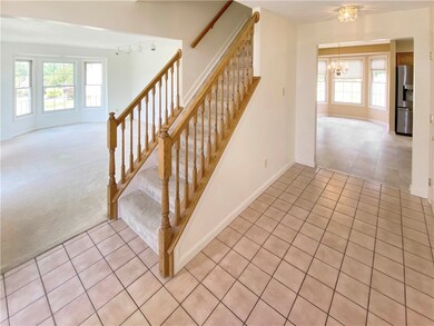 Center hall entry with ceramic tile floor.