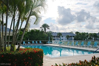 Community pool with fence and a patio area