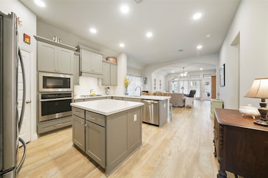 Look at this amazing island kitchen! Light gray sh