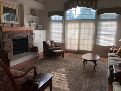 Stone gas log fireplace accents the family room wi