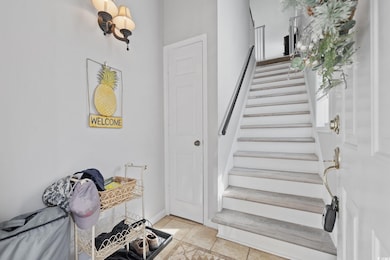 Stairs featuring tile patterned flooring