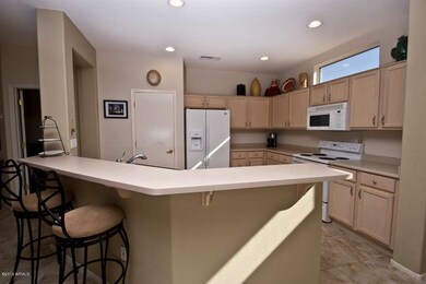 Kitchen Over Looks Great Room